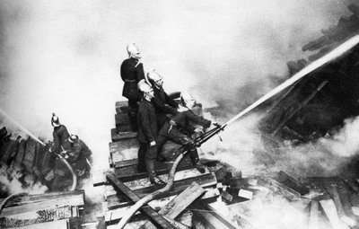 Firemen fighting a fire at a timber yard, London by Unbekannt