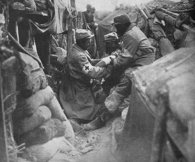First Aid to a Wounded Man in One of the French Trenches by Unbekannt