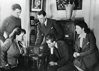 French Citizens Listening to a Broadcast by Vichy Deputy Premier Admiral Darlan by Unbekannt