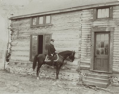General Frederick Dent Grant on horseback in front of the cabin (Hardscrabble) built by his father, Ulysses S. Grant by Unbekannt