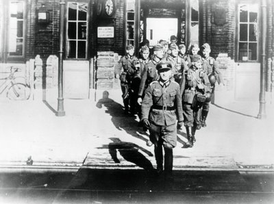 German army officer leading his company onto a railway station platform, Paris, August 1940 by Unbekannt