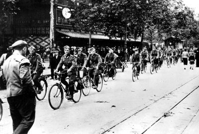 German Soldier Cycling Through the Streets of Paris by Unbekannt
