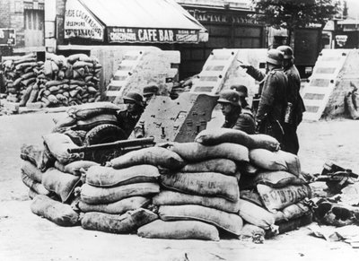 German Soldiers with Captured French Barricade, Near Paris, June 1940 by Unbekannt