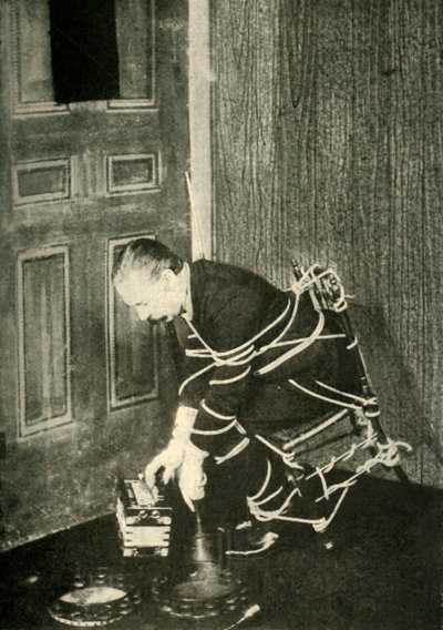 John Nevil Maskelyne Performs a Spirit Cabinet Illusion by Unbekannt