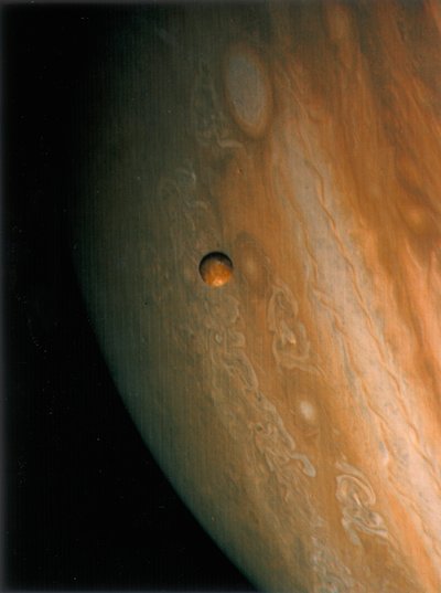 Jupiter and Io, one of its moons by Unbekannt