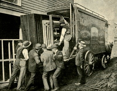 Loading the Camera on a Van for Removal by Unbekannt