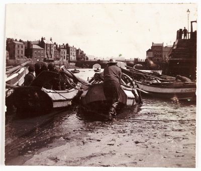Man launching a fishing boat, Whitby Harbour, c 1901 by Unbekannt