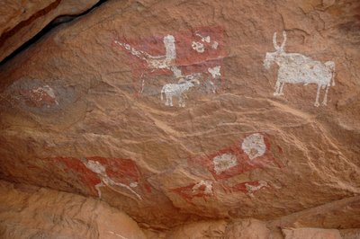 Rock Art, Prehistory: Rock Painting of a Group of Cattle and Sheep in an Ornate Shelter, Uweinat Massif, Sudan by Unbekannt