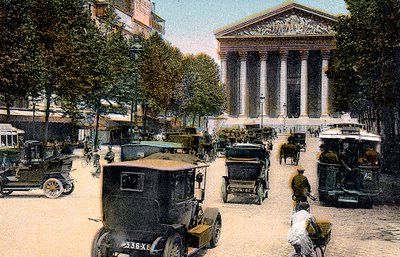 Rue Royale and the Madeleine, Paris, with cars and a motorbus on the street by Unbekannt