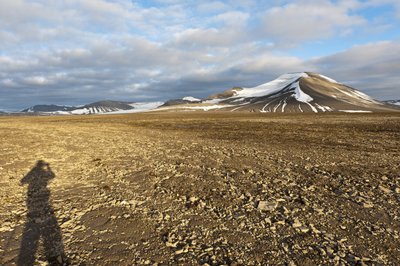 Shadow of a Human, Polygonal Structural Soil on Plataberget, Snow-Covered Peak Nordenskjoeldfjellet in the Back, Near Longyearbyen, Spitsbergen, Svalbard, Norway by Unbekannt