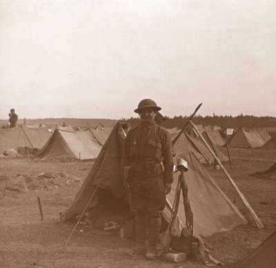 Soldier standing by tent, American camp, Melette, France by Unbekannt
