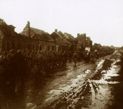 Soldiers Marching Past Bombed-Out Houses, Champagne, Northern France by Unbekannt
