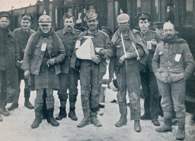 Some cheerful wounded from the Neuve Chapelle fighting, wearing captured German helmets, 1915 by Unbekannt