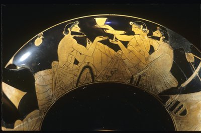 Symposium scene on red figure Attic kylix, wine cup, 5th century BC. by Unbekannt