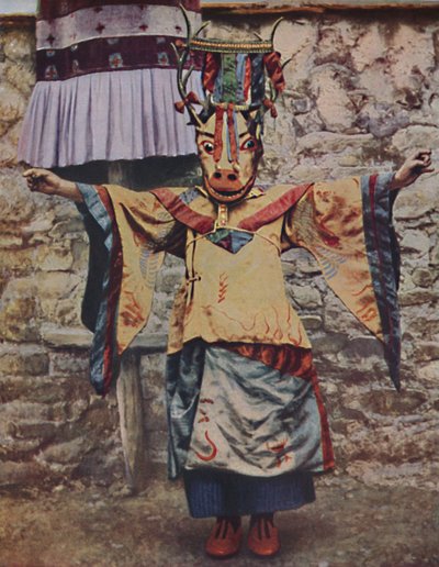 Tibetan lama attired for the devil dance by Unbekannt