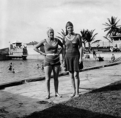 Two Women in Swimsuits Beside a Swimming Pool, Balboa, Panama, 1931 by Unbekannt