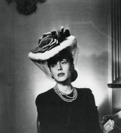 Woman Wearing a Hat and Veil by the French Fashion Designer Jacques Fath by Unbekannt