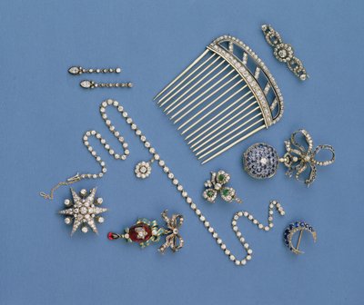 Selection of diamond jewellery: hair comb; graduated collet necklace; sapphire crescent brooch; enamel carbuncle pendant; fob watch; star brooch by Unbekannt Unbekannt