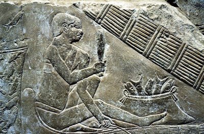 Ancient Egypt: Saqqarah: necropolis of the Old Empire, tomb of noble. Detail of reliefs representing a fisherman by Leopold Blonder