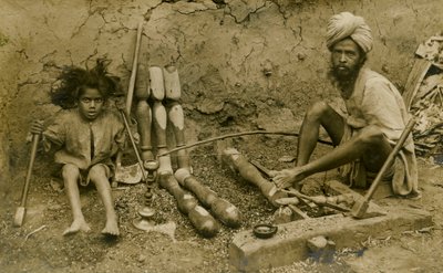 Carpenter and child working on bed legs by Unbekannter Künstler