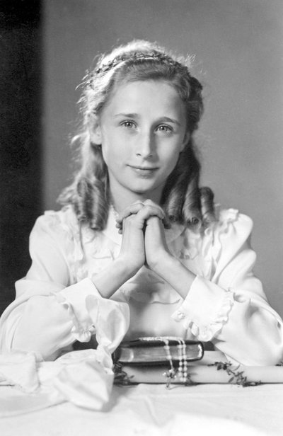 Christian Girl with Hands Joined in Prayer Position with Bible, Rosary and Candle (Photo of Communion) - 1932 by Unbekannt