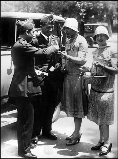 Madrid (Spain) June 1929: The two Spanish pilots Jimenez and Iglesias who return from their journey to South America (They crossed the Atlantic between Seville and Brazil in early April) buy flower vignettes for the benefit of the needy Madrid by Unbekannt