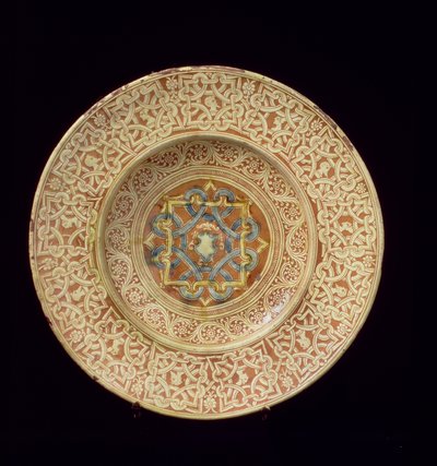 Maiolica Plate Decorated with an Elaborate Repetitive Knot Design Framing Profile Heads on the Border and a Shield in the Central Plaque, Italian, Made in Tuscany by Unknown