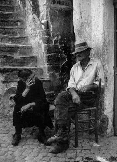 Man and Woman in Front of Their House by Unbekannt
