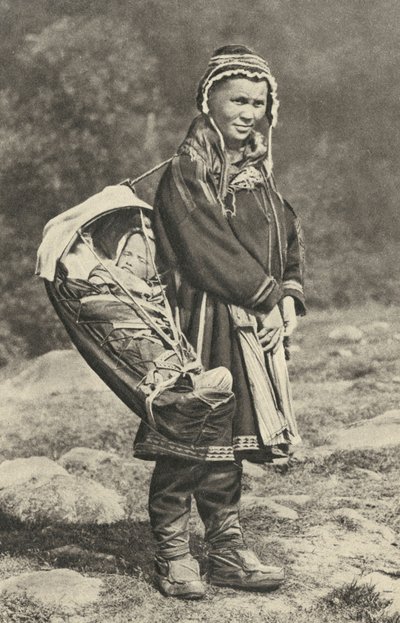 Sweden. Lapp woman carrying her baby in a cradle of reindeer skin. 1920 by Unbekannt