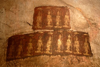Theravada Buddhism; ancient wall painting; standing Buddha Shakyamuni; Mudra; Varada; gesture of wish-granting; Tham Pa cave; at Nong Thang; Xieng Khouang province; Laos; Southeast Asia; Asia by Unbekannter Künstler