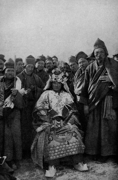 Tibet. Magician in full dress and an admiring band of monks. 1920 by Unbekannt