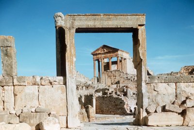 Roman ruins of the Capitol viewed through Dar el Acheb portal, Tunisia, Dougga by Benjamin Baud