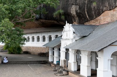 White building underneath a rock wall; cave temple; Golden Temple; Dambulla; Sri Lanka; Asia by Unbekannt