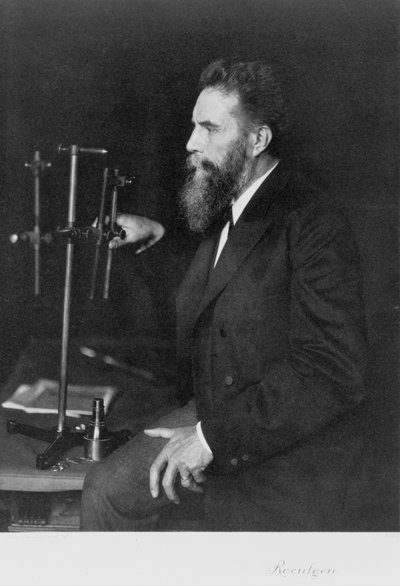 Wilhelm Conrad Roentgen, German physicist, at his workbench by Unbekannt