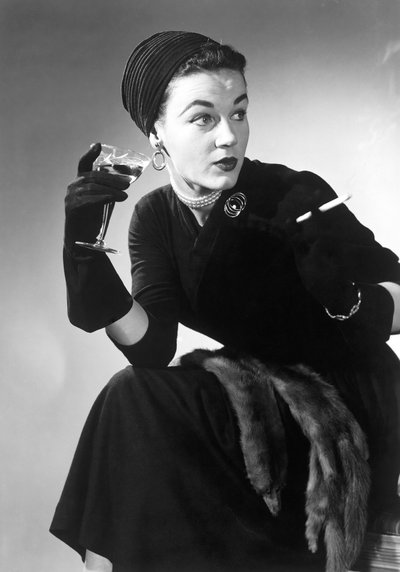 Woman in Evening Wear with Cocktail and Cigarette by Unbekannt