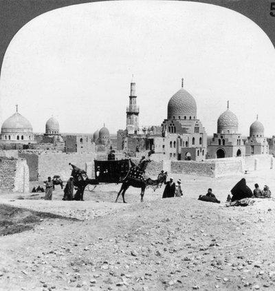 A Ship of the Desert Passing Tombs of By-Gone Moslem Rulers, Cairo, Egypt, 1905 by Underwood and Underwood