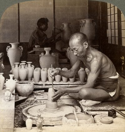 A Potter and His Wheel, Fashioning a Vase of Awata Porcelain, Kinkosan Works, Kyoto, Japan, 1904 by Underwood and Underwood