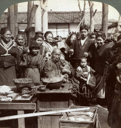 A street performer with a monkey amusing the crowd, Kobe, Japan, 1896 by Underwood and Underwood