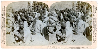 Boxer prisoners captured and brought in by the US 6th Cavalry, Tientsin, China, 1901 by Underwood and Underwood