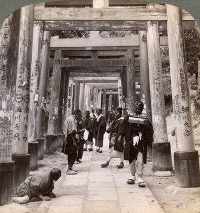 Coming and Going Under Long Rows of Sacred Torii, Shinto Temple of Inari, Kyoto, Japan by Underwood and Underwood