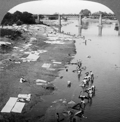 Dhobis Washing Clothes in the Gomti River, Near Lucknow, India, 1900s by Underwood and Underwood