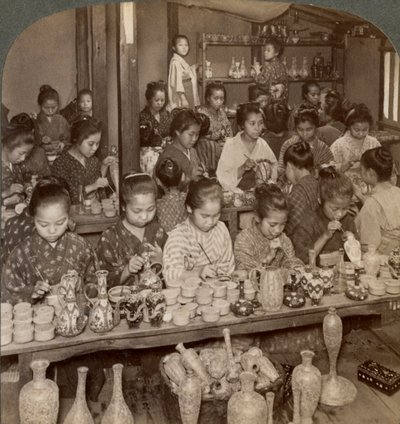 Factory girls decorating cheap pottery for the foreign markets, Kyoto, Japan, 1904 by Underwood and Underwood