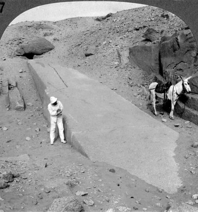 Ninety-two foot obelisk still lying in the quarry of Assuan, Aswan, Egypt by Underwood and Underwood