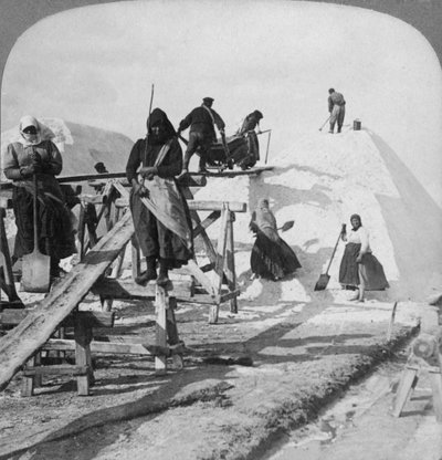 Stacking salt in the great salt fields of Solinen, Black Sea, Russia, 1898 by Underwood and Underwood