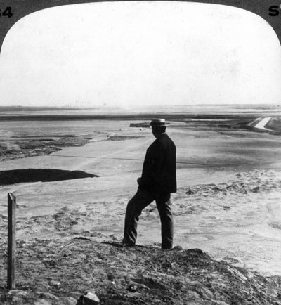 Watching a sand whirlwind from the top of Hawara pyramid, Egypt by Underwood and Underwood