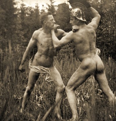Fighting battle pose with a Roman Helmet, c.1910 by Unknown