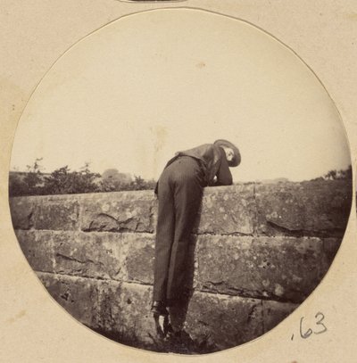 Man in Hat Bent Over a Stone Wall by Unknown artist