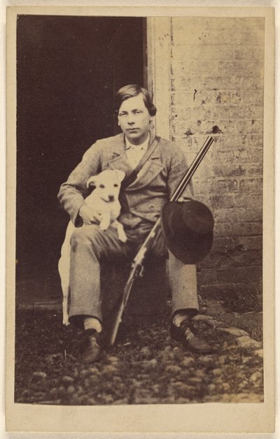 Man Seated with a White Dog, a Rifle and Hat Leaning on His Leg by Unknown artist
