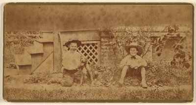Two Boys Seated on Ground with a Dog by Unknown artist