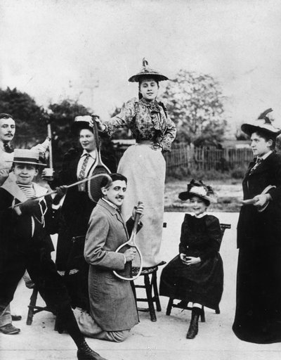 Marcel Proust Kneeling with a Tennis Racket in Front of Jeanne Ponquet Standing on a Chair in Neuilly, 1892 by Unknown photographer